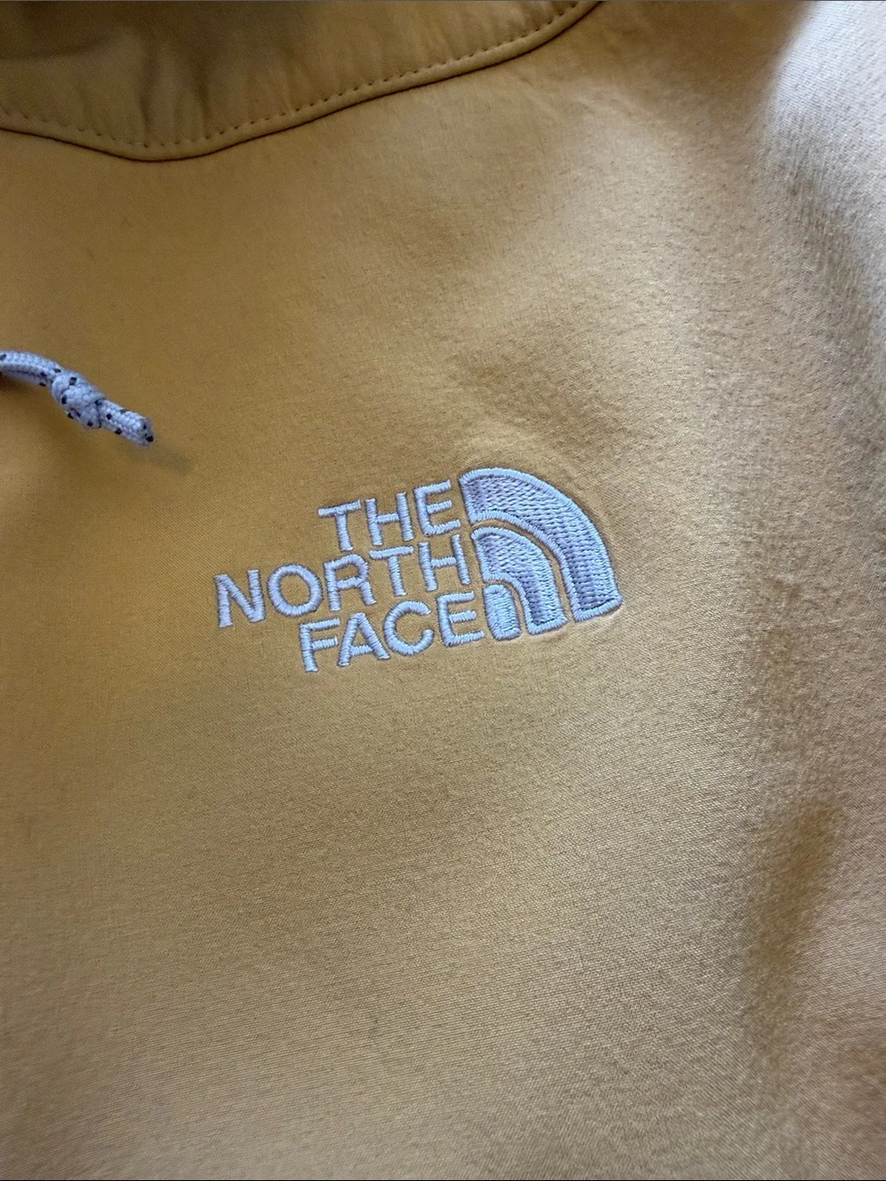 The North Face Yellow Softshell Jacket with Gray Lining